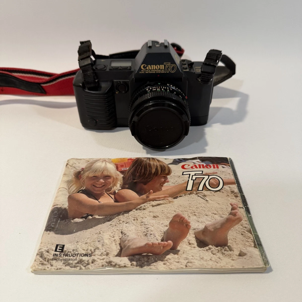 Canon T70 Vintage Analog Camera lot de 4 Lire Descriptif