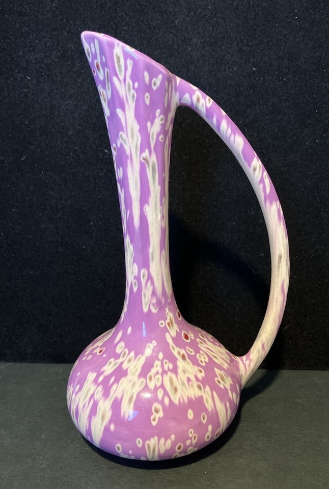 That bold purple drip glaze is a shelf showstopper — moody, sculptural, and unmistakably MCM.