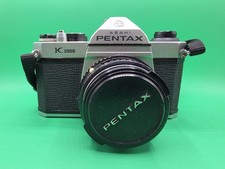 Pentax K1000 fotocamera pellicola 35 mm con obiettivo SMC Pentax-M 50 mm f/2 scatola documenti