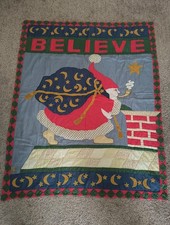 Santa Christmas themed decorative quilt