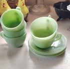These are vintage Fire-King Jadeite Jane Ray tea cups and saucers