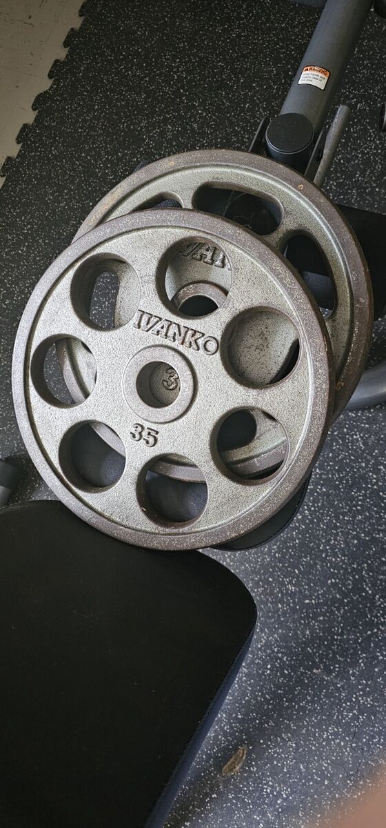 2 IVANKO REVOLVER'S 35LB GRIP PLATES/ PLEASE READ THE 2 IVANKO REVOLVER'S 35LB GRIP PLATES/ PLEASE READ THE