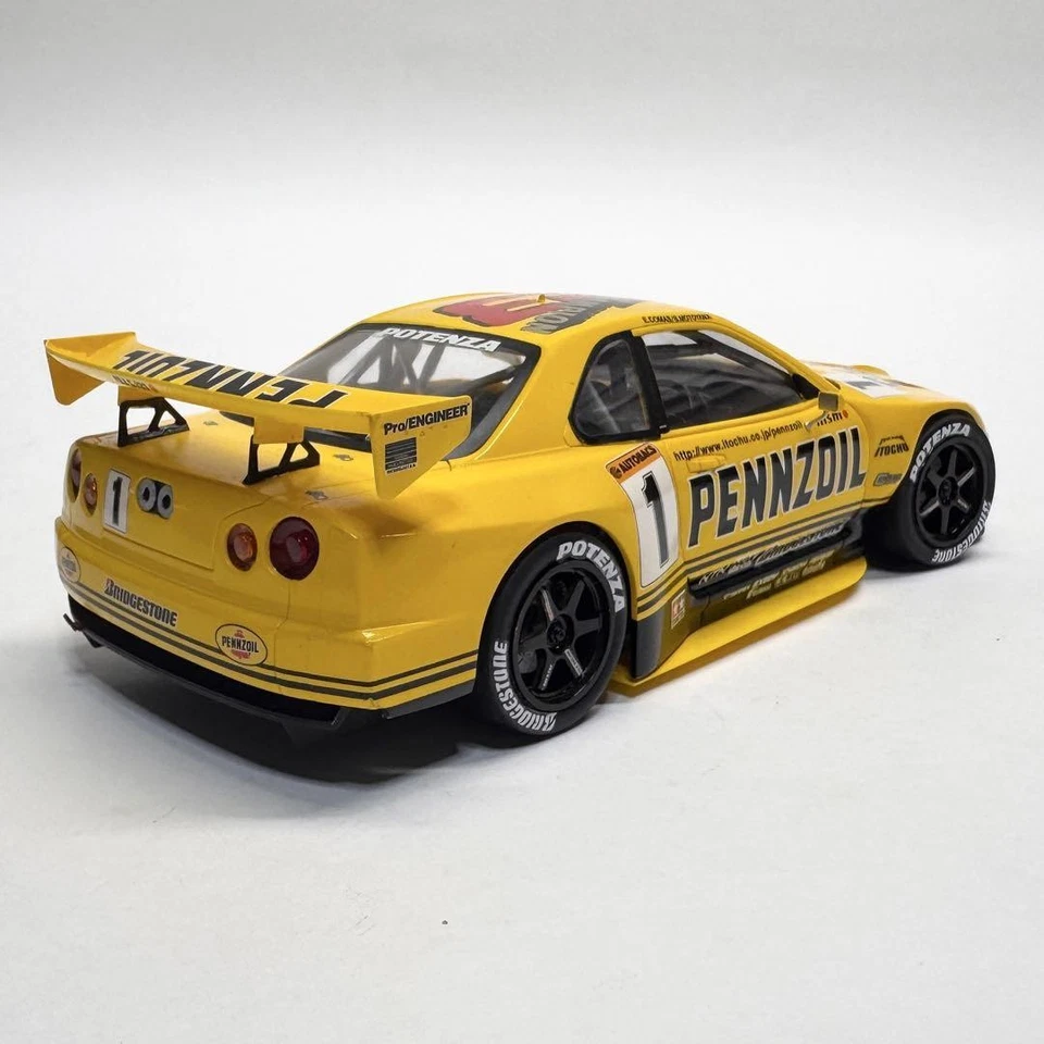 TAMIYA 1/24 NISSAN PENNZOIL NISMO GT-R (R34) Model Kit Plastica #654 - Immagine 2 di 4