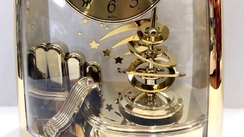 Rhythm Mantel Clock Gold with Rotating Pendulum and Shooting Stars 4SG607WS65 - Video 1 of 1