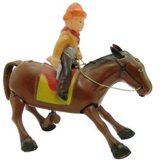 Occupied Japan Tin and Celluloid Cowboy on Horse Wind-up Toy - Near Mint
