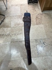 Gun Slip. Brown Leather Exterior With Blue Padded Interior. Unbranded. Used.