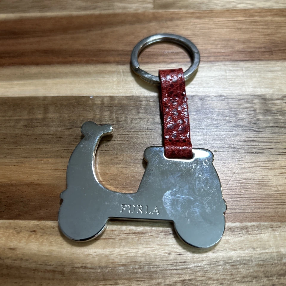 Lote de 3 Llaveros y Bolso Furla - Avión, Scooter y Arco Cuero Italiano Foto 2 de 4