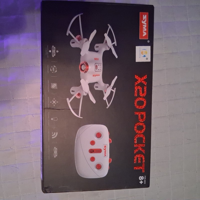 White Syma X20 RC quadcopter w/ remote. 360flip, auto hovering and take off/land