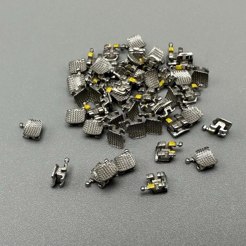 50 pezzi staffe ortodontiche dentali staffe STD MBT 022 slot 3 ganci metallo sfuso - Foto 20 di 24