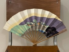 A vintage Japanese hand painted folding fan with design of urban street, 1950s