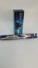Toothpaste with a brush and toothpaste with whitening charcoal active ingredient