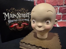 Disney It's a Small World Animatronic Doll Head prop hand signed by Bob Gurr