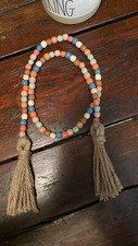 Handmade wooden bead garland with tassel, farmhouse style