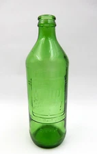 VINTAGE 7UP SODA POP GREEN GLASS BOTTLE 1 PINT WITH "YOU LIKE IT - IT LIKES YOU"