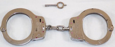 SMITH  WESSON M-100 HANDCUFFS WITH 1 KEY GOOD USED CONDITION H62200 RED DOTS