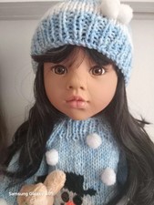 Gotz Doll .with extra clothes.