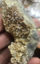 Siderite e piccoli cristalli di calcite dalla miniera di Brosso