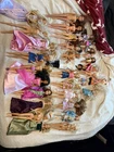lot of 33 BARBIE, Mattel & others with Miscellaneous Clothes sold AS IS