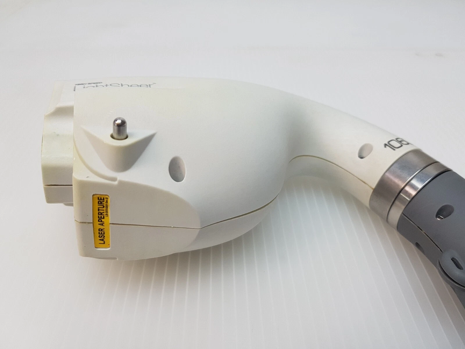 LightSheer 1060 handpiece head with LASER APERTURE label