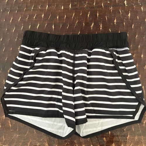 ivivva by Lululemon girls size 12. Black and white striped. Zipper side pockets.