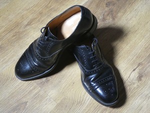 loake black leather brogues