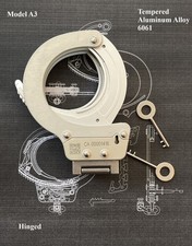 A3: Collectible modern hinged handcuffs with pressure-activated lock
