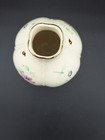 White round LENOX MORNINGSIDE vase with gold rim, dragonfly and bee motifs, and purple fabric design on dark background.