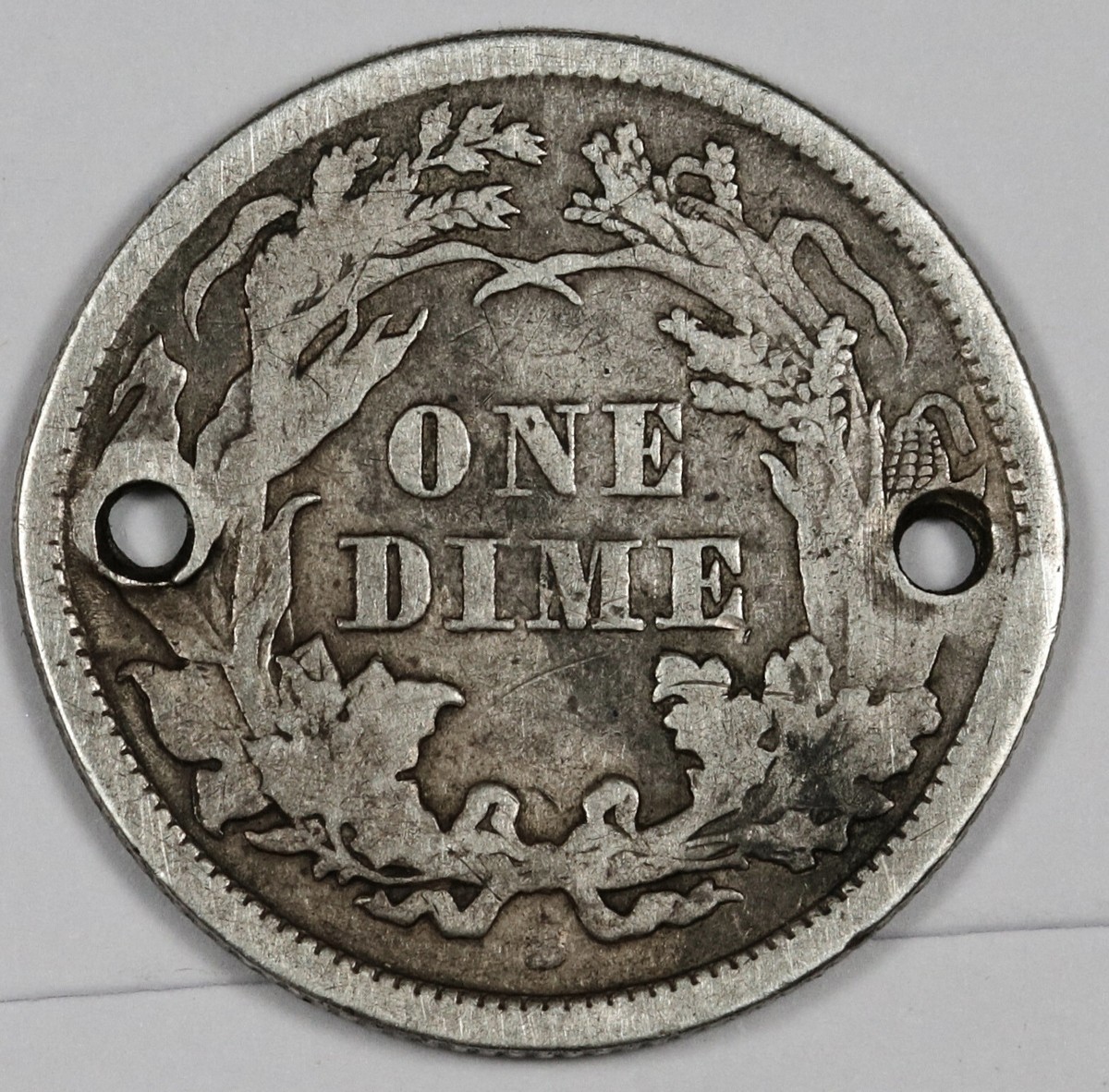 1869-s Seated Liberty Dime. Double Holed. XF Detail. 185820