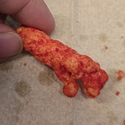 single hot cheetos Piece (Single) Puffed Snack shaped like a hand