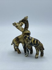 Entwined Giraffe Figures By Collage