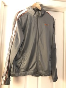 grey nike tracksuit with orange stripe