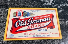 A) IRTP OLD GERMAN BEER 12OZ BOTTLE LABEL QUEEN CITY BREWING CO CUMBERLAND MD