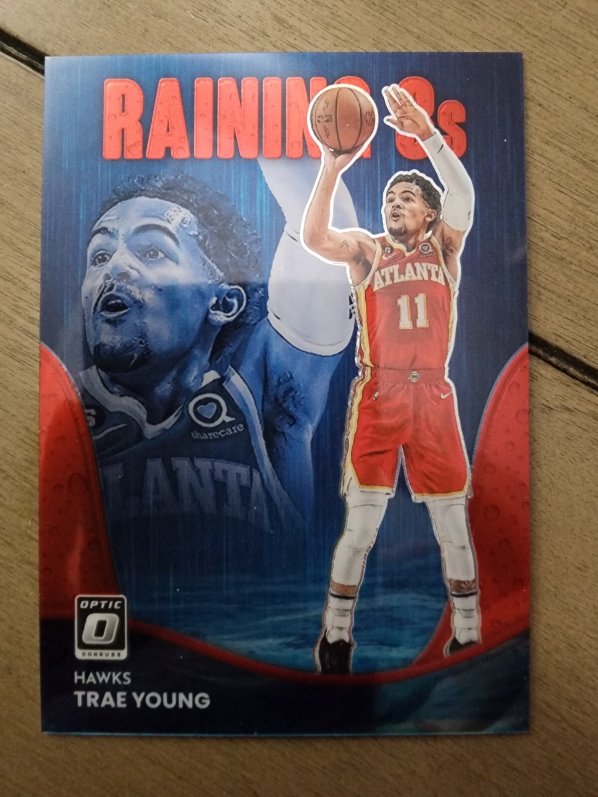 Trae Young 2022-23 Optic Raining 3s Red Prizm /99