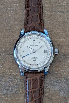 Grand Seiko SBGJ217 Hi-Beat GMT - Full Set Box Papers Unworn OEM Strap Deployant