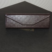 GUCCI Triangular Dark Brown Leather Embossed ...