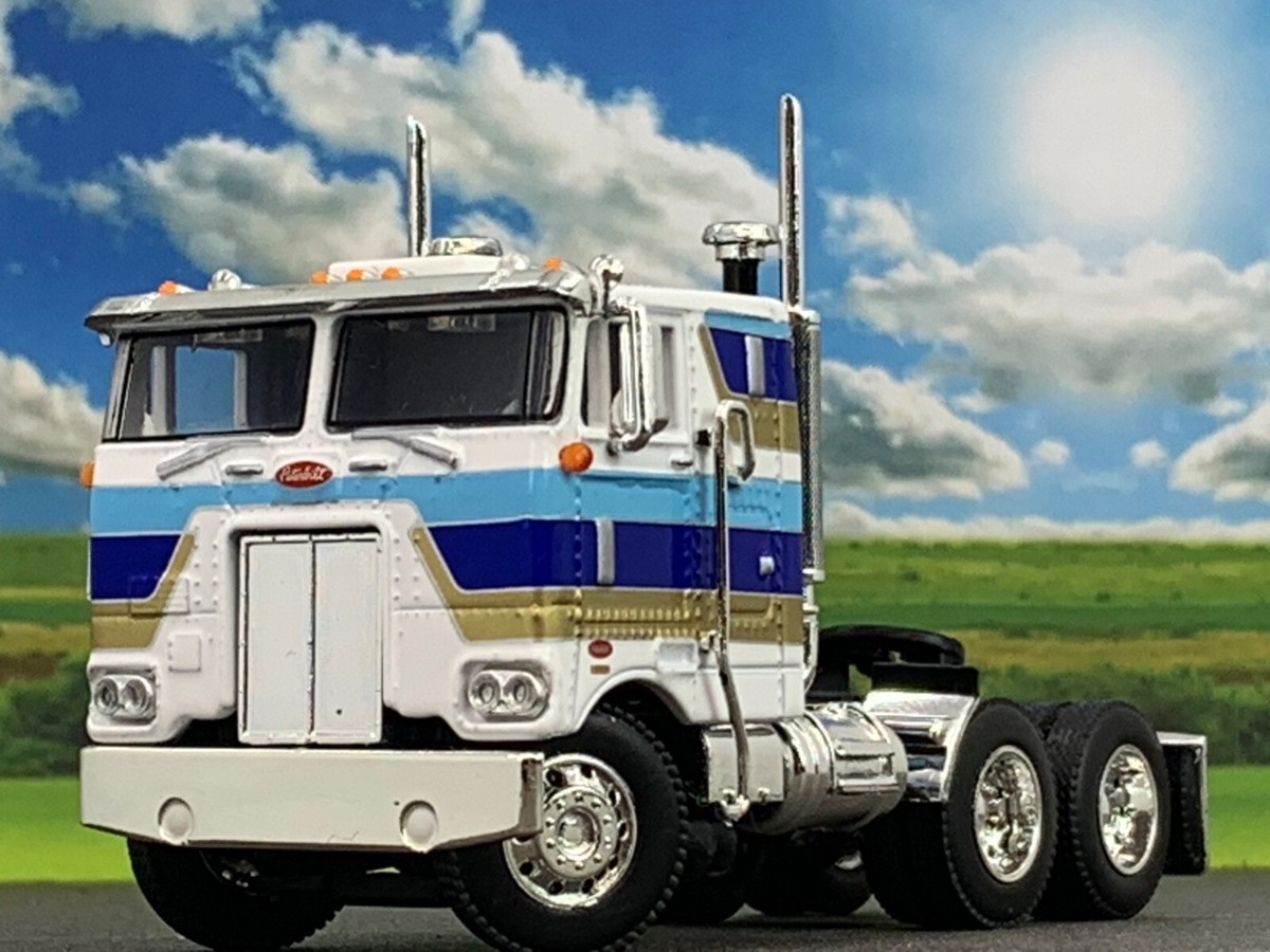 1/64 DCP WHITE/BLUE/GOLD 352 PETERBILT 86