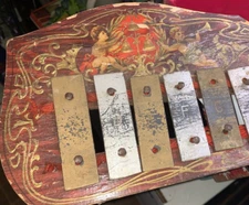 VINTAGE SCHOENHUT  WOODEN XYLOPHONE W/PAPER OVER ILLUSTRATION.