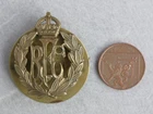 A voided WW1 Royal Flying Corps RFC brass cap badge with back plate/cotter pin