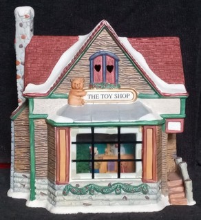 Christmas Village lit Toy Shop with Picture Window View of Child buying present