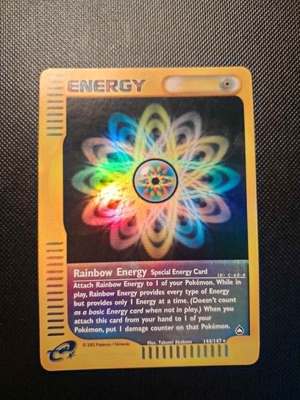 Pokemon Rainbow Energy 144/147 Aquapolis Reverse Holo Card. Excellent Condition