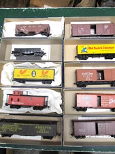 Ten Roundhouse Boxes with Variety of Great HO Train Cars
