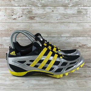 black and yellow athletic shoes