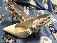 Christian Dior Patent Leather Slingback Pumps...