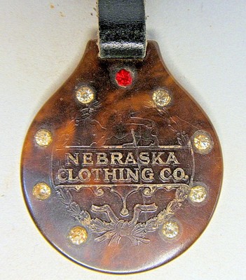 circa 1910 NEBRASKA CLOTHING CO. faux tortoise watch fob w/ strap