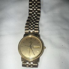 OMEGA De Ville Men’s Dress Quartz Analog Gold Dial Gold-Tone Bracelet Day-Date