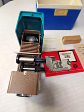 Vintage USSR slide projector with original box and documents, 1974