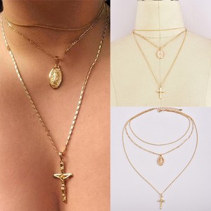 cross and virgin mary necklace