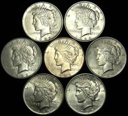 1922-1925 LOT OF 7 MIXED DATE/MINTMARK PEACE SILVER DOLLARS IN GRADES AU & BU