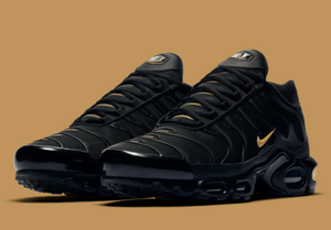 nike gold and black trainers