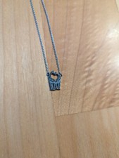 Giraffe Kissing Necklace, heart cutout, silver, gently used- great condition